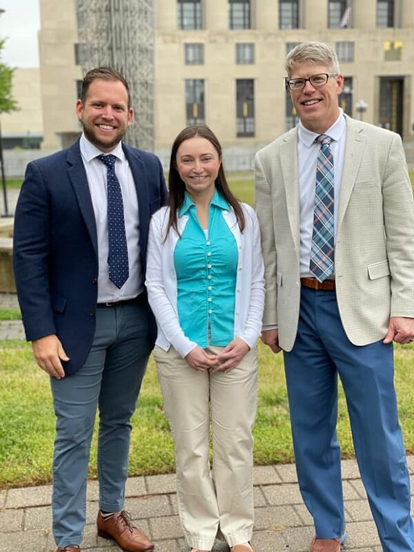 Our client Brandi with trial attorneys John Griffith and Joshua Cantrell
