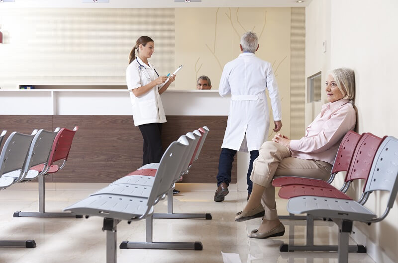 Woman waiting in a doctors office waiting room