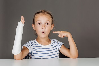 Young girl with growth plate fracture broken bone in wrist