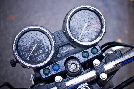 Motorcycle gauges wet with raindrops