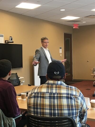 Personal injury trial attorney John Griffith speaking at a focus group
