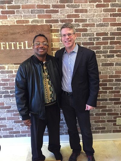 John standing with his car accident client Jimmy