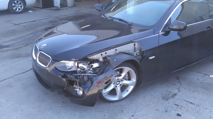 Mark's wrecked BWM with front-end damage