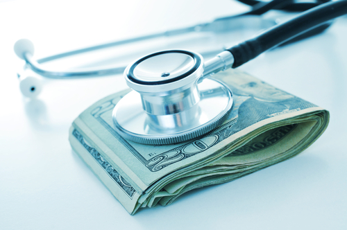 medical bills and twenty dollar bills