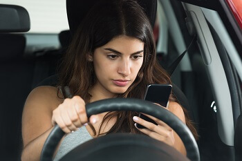 Woman driver illegally texting while driving in Tennessee
