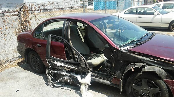 Passenger side of a wrecked 2006 Saturn SL