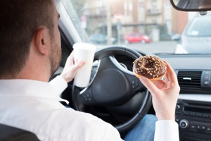 dangerous and distracted driver eating while driving in Tennessee
