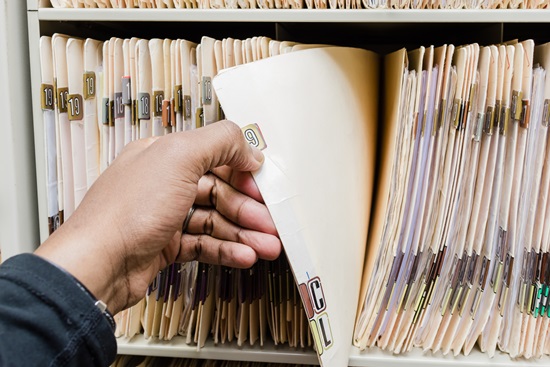 medical assistant pulling patient records