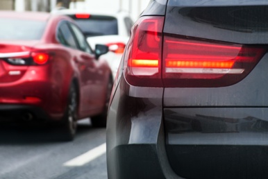 backs of cars in traffic