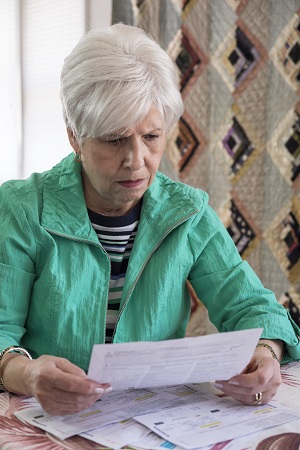 Concerned woman trying to understand car accident medical bills