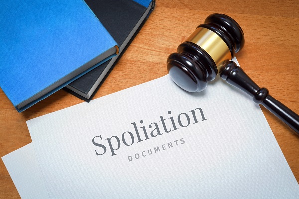 Spoliation documents on a desk with a gavel
