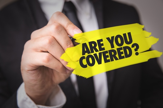 man in suit writing are you covered