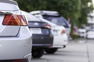 back of cars in parking lot