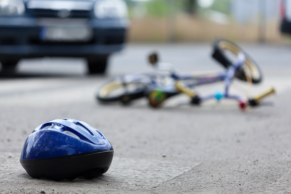 bicycle accident with rider's helmet knocked off