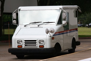 postal truck parked on the side of the road
