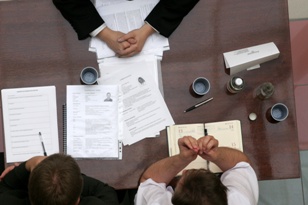 overhead shot of meeting at conference table