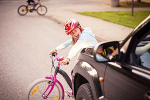 Child on bike hit by a car