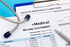 Medical bills and stethoscope