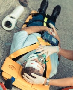 Pedestrian crash victim being treated at the scene of the accident.