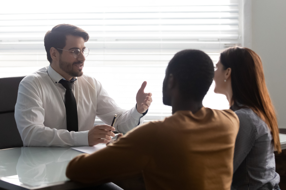 A Lawyer in a consultation with clients. Learn what to look for when choosing a personal injury lawyer.